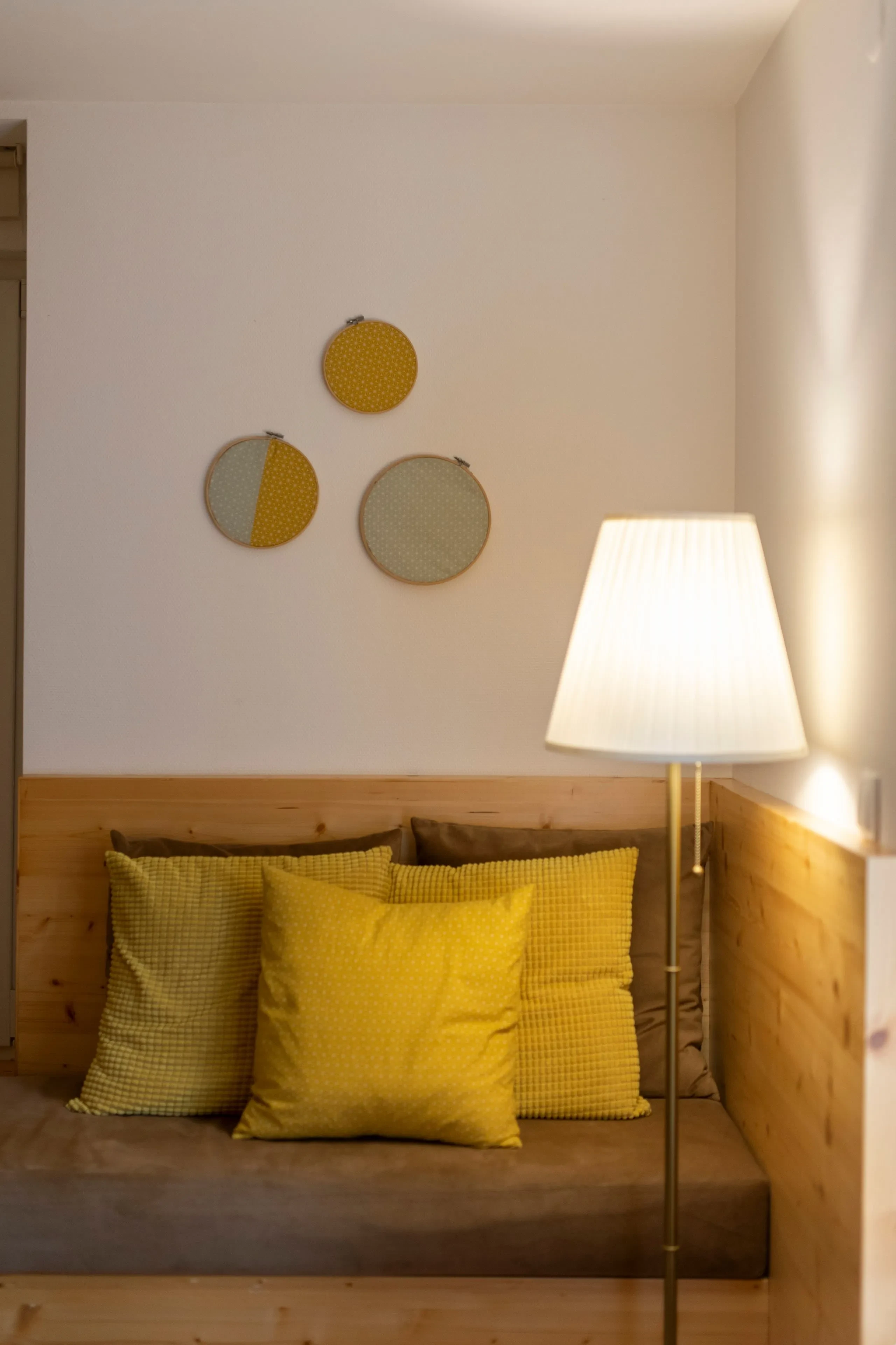 Cozy corner with pillows and lamp