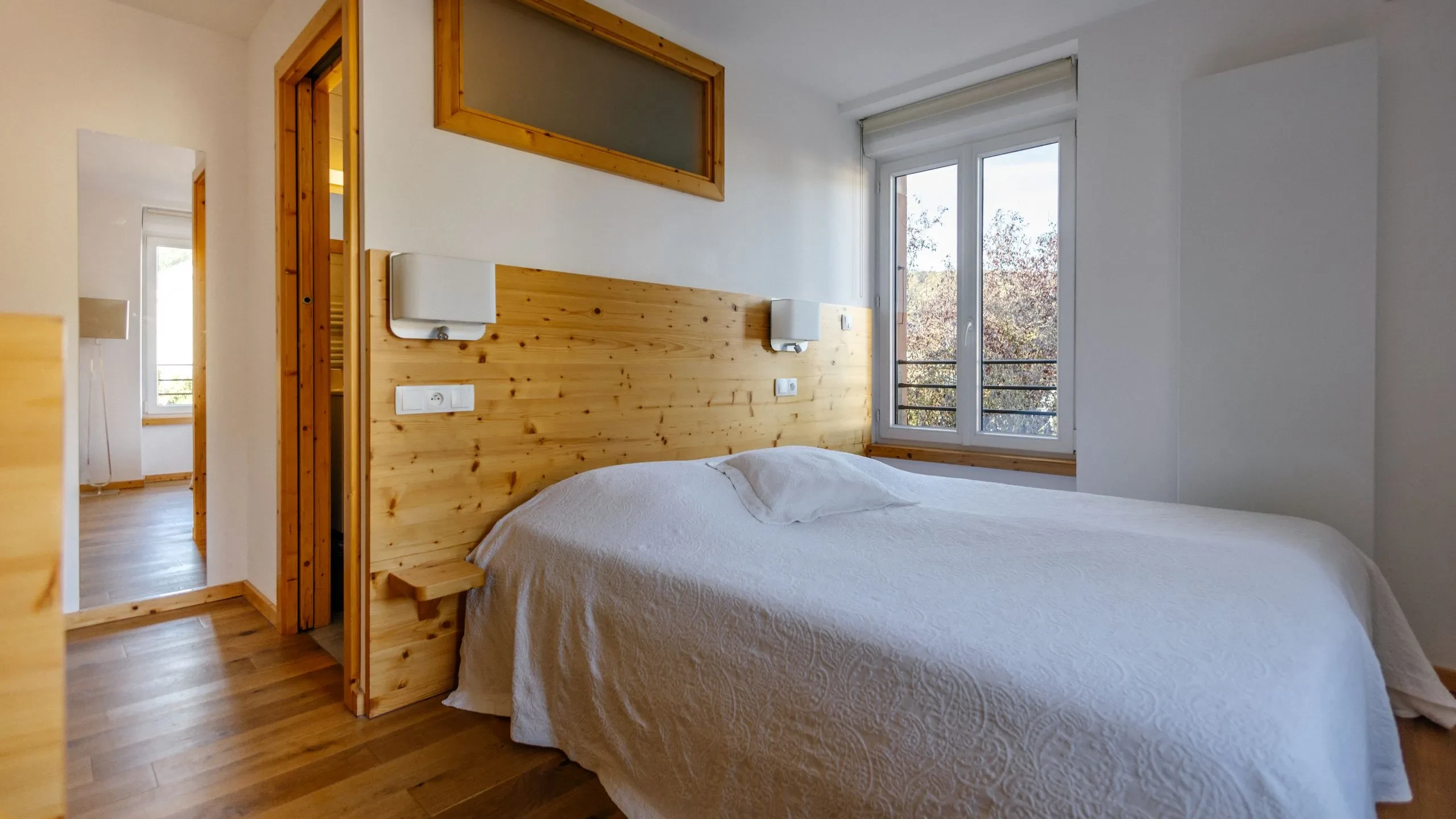 Modern bedroom with wooden accents and window