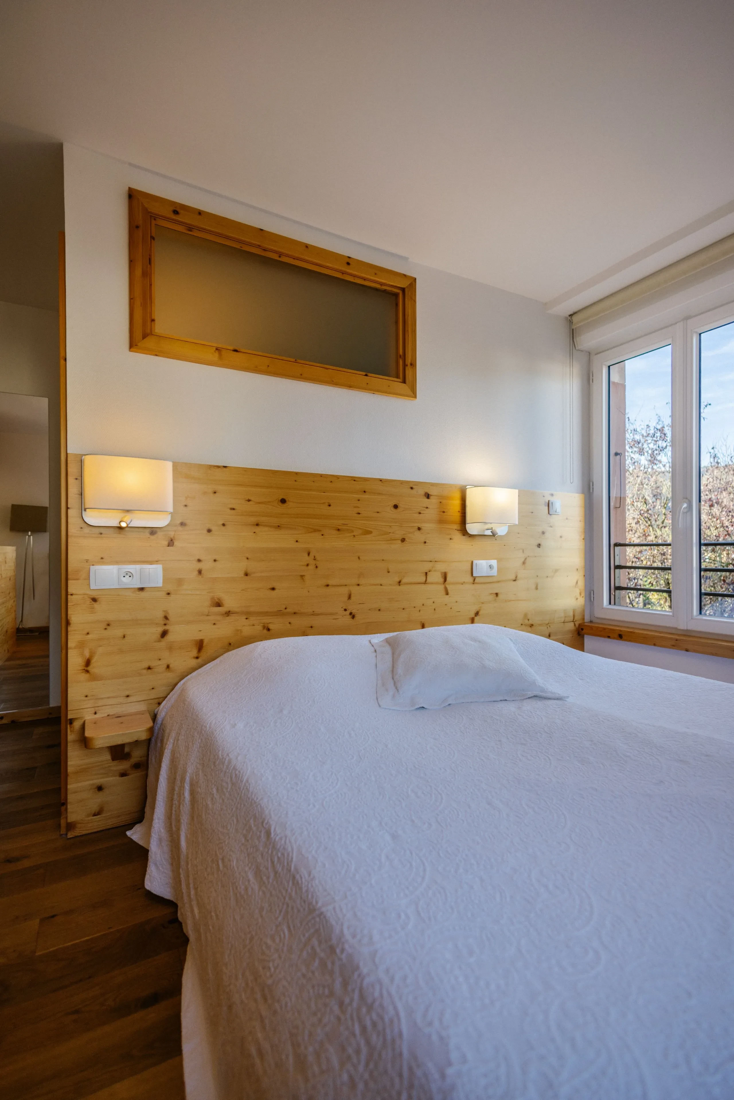 Cozy bedroom with white bedspread