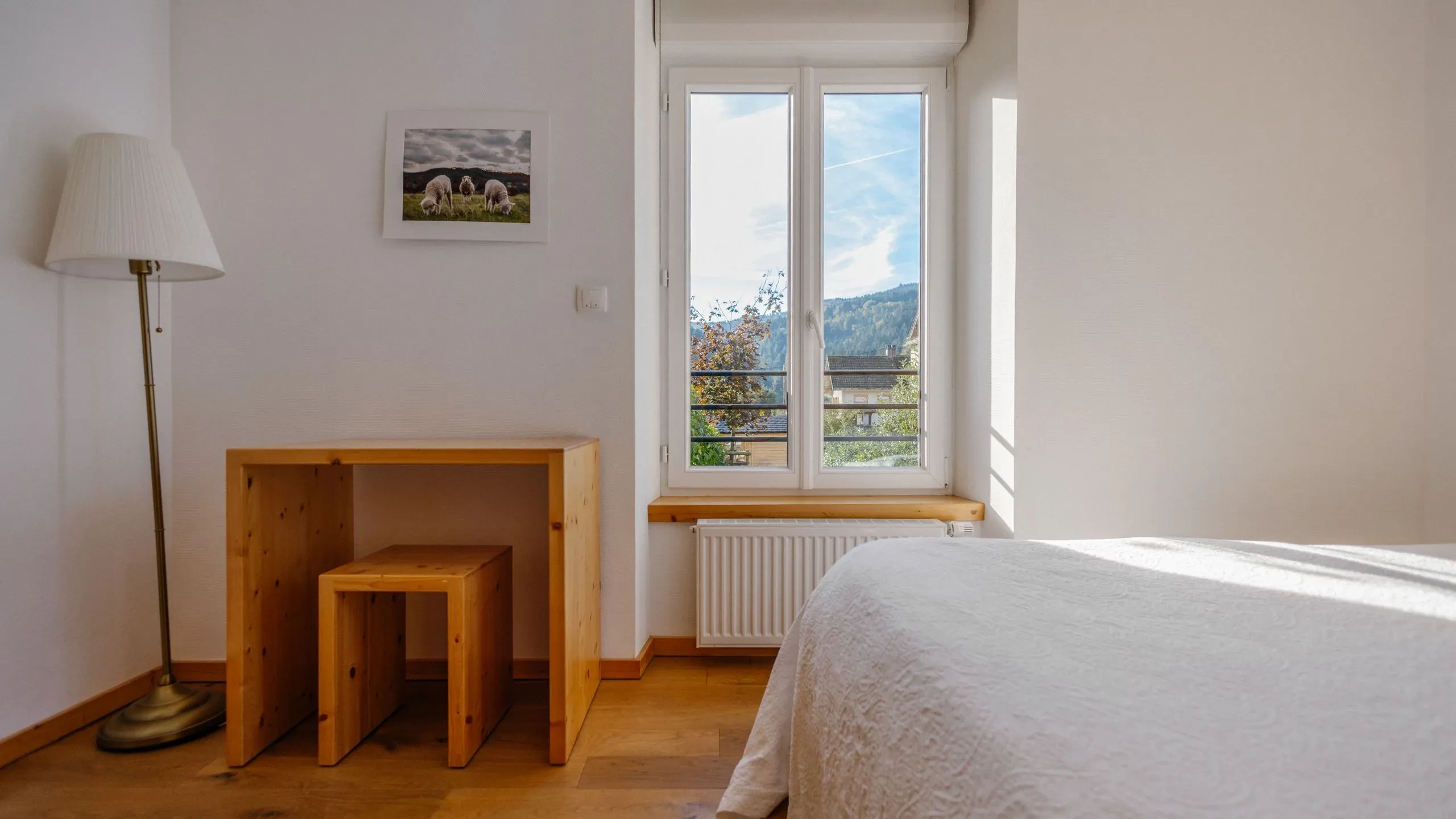 Bright bedroom with mountain view.