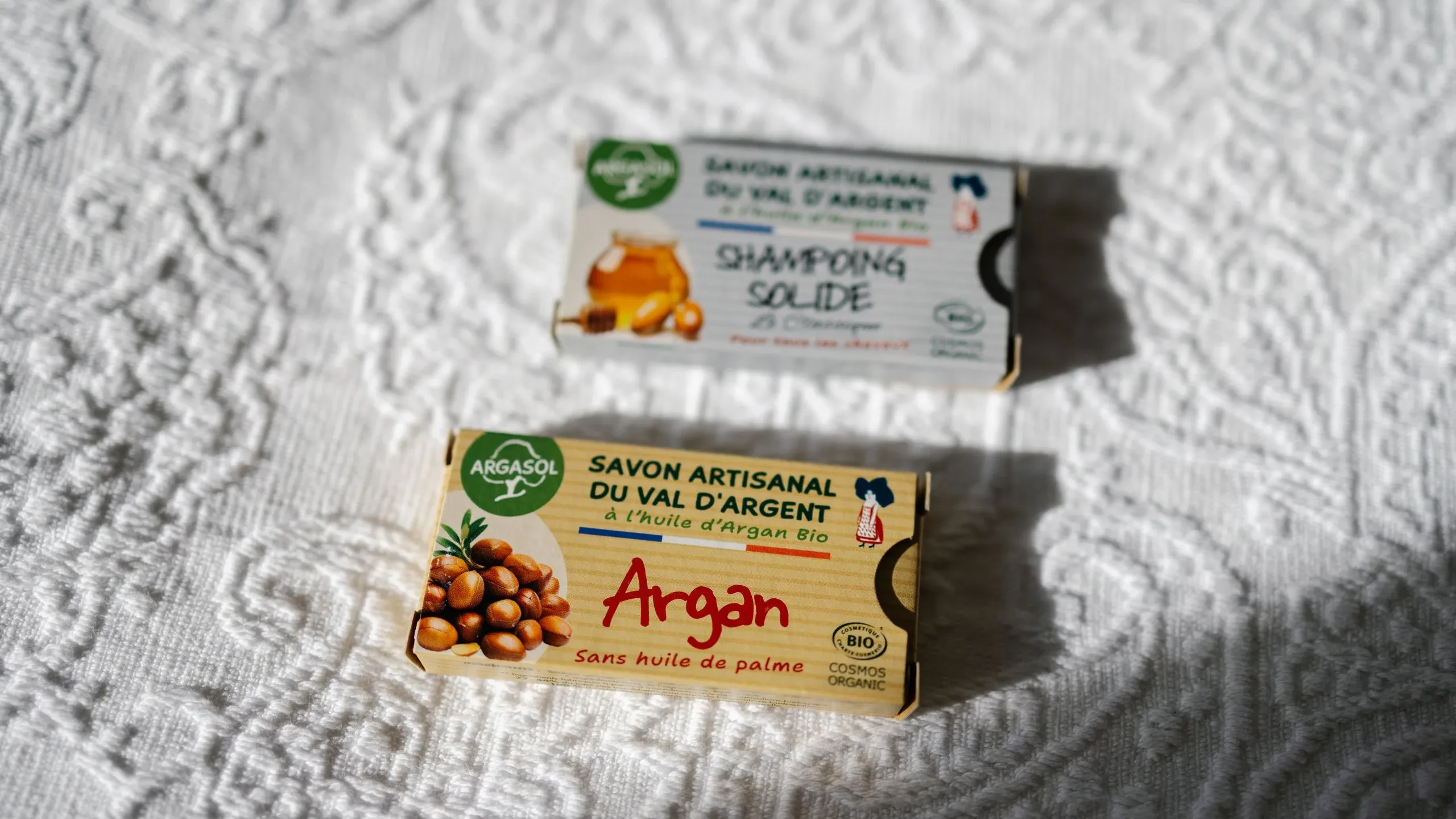 Artisanal soap products on textured cloth